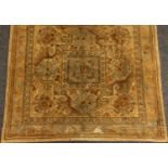 A 19th century Middle Eastern woollen rug, worked in gilt thread with hooked medallions,