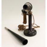 An early 20th century candlestick telephone,