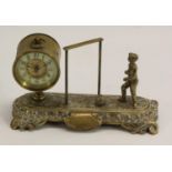 Football - a late Victorian brass novelty timepiece, as a footballer standing before an open goal,