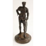 Continental School, a brown patinated bronze, of a cavalry officer, he stands, in dress uniform,