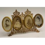 A 19th century gilt tetraptych easel photograph frame, pierced and engraved with scrolling ferns,