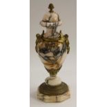 A French gilt metal mounted Breccia marble ovoid mantel urn, pine cone finial,