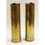 A pair of German World War One Trench Art mantel spill vases,