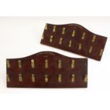 A pair of early 20th century mahogany patent playing card dummies, brass clips,