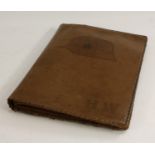 A leather map case,