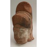 Antiquities - a large Chinese pink sandstone sculptural fragment,