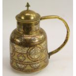 A Middle Eastern silver and copper damascened brass flagon,