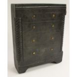 A 19th century Welsh vernacular slate model of a miniature chest of drawers,