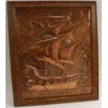 An Arts and Crafts beaten copper panel, repousse chased with a galleon in full sale, 60cm x 50cm, c.