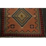 A Middle Eastern rectangular woollen rug,