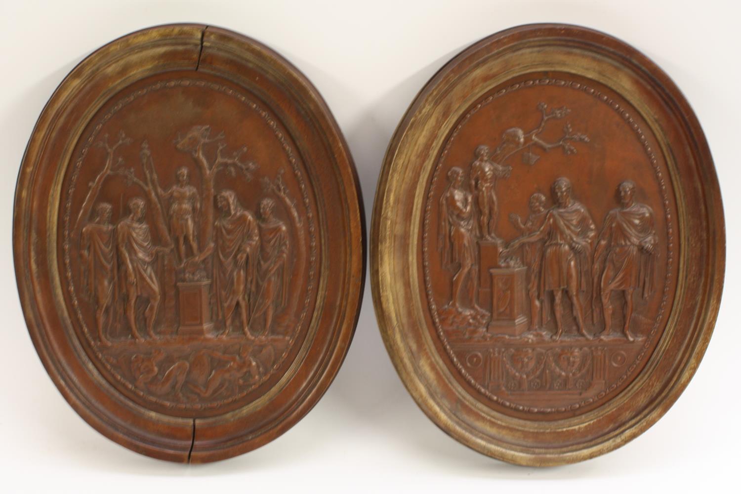 A pair of 19th century bronzed oval plaques, in the Grand Tour taste,