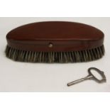 An unusual early 20th century mahogany musical clothes brush,