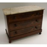 A 19th century miniature chest of drawers, oversailing marble top above three long drawers,