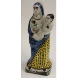 A French faience figure, of the Madonna and child, 27cm high,