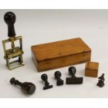 A collection of desk seals, various forms and matrices, the largest a mechanical example, 21.