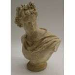 A Grand Tour type composition library bust, of the Apollo Belvedere, waisted socle,