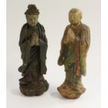 A Chinese polychrome carving, of a Buddhist monk, he stands serene, upon a lortus,