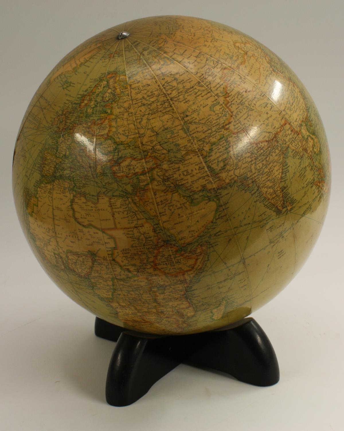 A 12" library globe, by George Phillip & Son Ltd for Georama Ltd, ebonised X-frame stand, 35cm high,