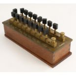 An early to mid-20th century Post Office plug key resistance box, by Phillip Harris Ltd,