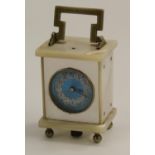 An early 20th century Swiss mother of pearl miniature carriage timepiece,