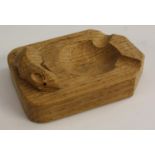 Robert Thompson, Mouseman of Kilburn - an oak canted rectangular ashtray, adzed overall,