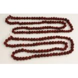 A Chinese red stained nut kernel necklace,