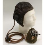 An Air Ministry issue brown leather flying helmet, chamois lined,