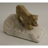 An Austrian cold painted bronze, of a polar bear, tentatively inching down a slope,