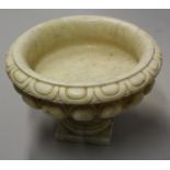 A large 18th century style marble half-fluted compressed campana table urn, evolo rim, square base,