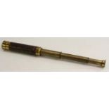 A 19th century lacquered brass three-draw telescope, leather grip,