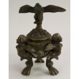 A Renaissance Revival bronze tripod inkwell, eagle cresting, boldly cast satyr monopodia, 16.