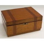 An Art Deco period oak and mahogany cigar humidor, hinged cover enclosing a lift-out tray, 30.