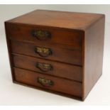 A late Victorian mahogany table-top chest, rounded rectangular flush top above four drawers,