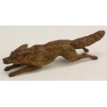 An Austrian cold painted bronze, of a fox, at full pelt,