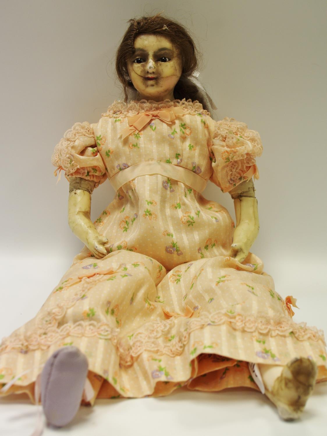 A late 19th century wax and composite doll, wax head and limbs, brown glass eyes,