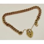 A 9ct rose gold curb bracelet, each link stamped 375, a later 9ct gold heart padlock 20.