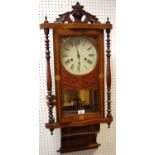 A Victorian walnut and mahogany Vienna wall clock