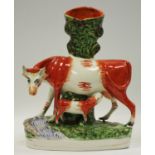 A large Victorian Staffordshire suckling calf spill vase
