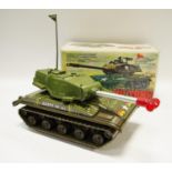 A vintage tin-plate & plastic battery operated M-41 Army Tank, firing & flashing cannon,
