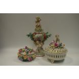 An Augustus Rex 19th century Dresden porcelain twin handled urn and cover decorated with putti and