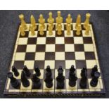 A large softwood Cezar Chess set by Madon, the large pieces measuring 21cms,