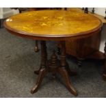 A Victorian walnut and mahogany oval breakfast table,