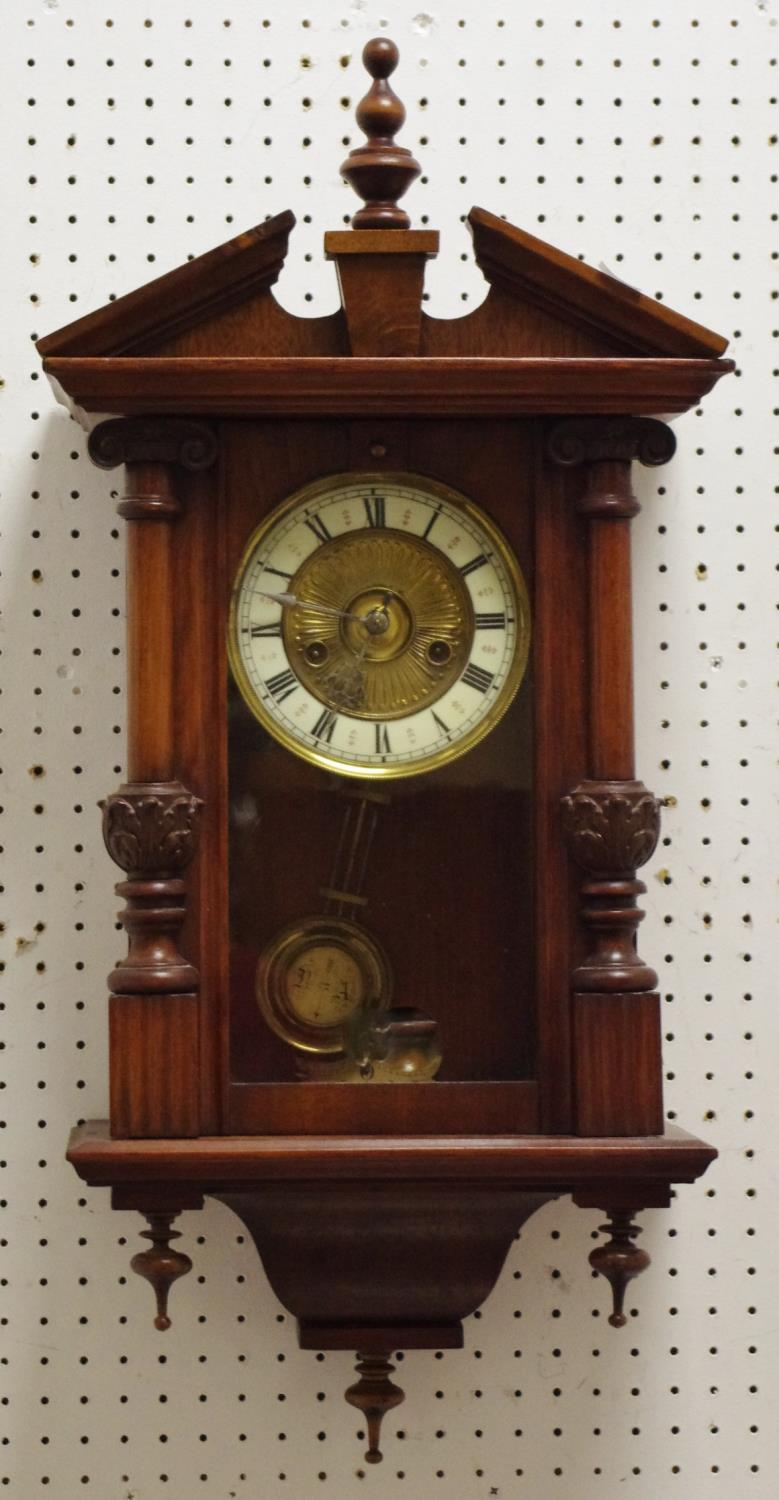 A reproduction acanthus capped mahogany pine and walnut wall clock, with porcelain dial,