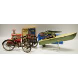 An interesting metal cargo tricycle working model; a tinplate pop-pop boat with heating element c.