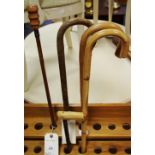 Walking sticks - two crooks; an market stick; a walking pole;