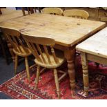 A pine country kitchen table, plank top, single drawer to frieze, turned legs,