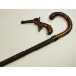 A 19th century muff pistol or postman's dog scarer with round & octagonal barrel and walnut grip;