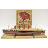A boxed Chad Valley White Star Jigsaw Puzzle, R.M.S 'Queen Mary'; a scale model of R.M.S.
