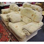 A contemporary three piece suite comprising two seat settee and two armchairs.
