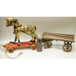 A Victorian child's pull along wooden toy in the form of a dapple grey horse with a wooden flat bed